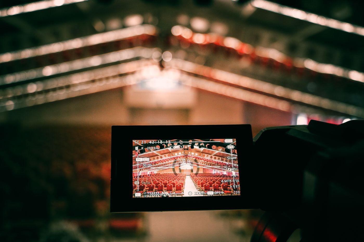 Camera viewfinder framing an empty auditorium